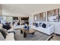 Open-concept living space showcasing elegant decor, connecting seamlessly to the dining and kitchen areas at 1320 Loraine N Cir, Lafayette, CO 80026