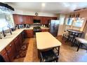Spacious kitchen features an island and stainless steel appliances at 13474 W 65Th Dr, Arvada, CO 80004