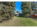 Expansive backyard with mature trees, offering privacy and ample space at 2862 S Grant St, Englewood, CO 80113