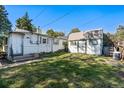 View of backyard featuring a storage shed and potential for outdoor activities at 2862 S Grant St, Englewood, CO 80113