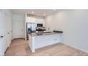 Modern kitchen with stainless steel appliances and a kitchen island at 1926 S Haleyville Way, Aurora, CO 80018