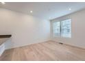 Bright living room with hardwood floors and large windows at 1926 S Haleyville Way, Aurora, CO 80018