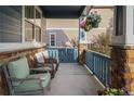 Relaxing front porch featuring comfortable wicker seating, providing a perfect spot to unwind at 23327 E Ottawa Dr, Aurora, CO 80016