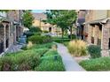 Professionally landscaped green space and walking path at 15362 W 66Th Ave # D, Arvada, CO 80007