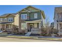 Beautiful two-story home with a welcoming front porch and well-maintained landscaping at 2572 Iola St, Aurora, CO 80010