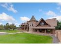 Majestic home featuring unique architectural details and sprawling green landscape at 11485 Pecos St, Denver, CO 80234
