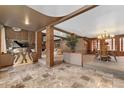 Elegant living space showcasing marble floors, brick pillars, and classic decor at 11485 Pecos St, Denver, CO 80234
