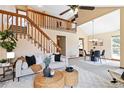 Open floor plan showcasing a living room, dining area, and staircase at 2136 S Scranton Way, Aurora, CO 80014