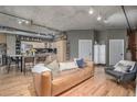 Open-concept living room with hardwood floors and modern decor at 1499 Blake St # 4F, Denver, CO 80202
