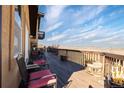 Wide angle daytime shot of the expansive balcony overlooking the yard and valley beyond at 11730 Pointe View Dr, Longmont, CO 80503