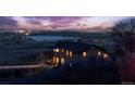 Beautiful house with city views, as seen from the hillside at 11730 Pointe View Dr, Longmont, CO 80503