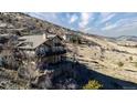 Beautiful home nestled into hillside with multiple decks and stunning views at 11730 Pointe View Dr, Longmont, CO 80503