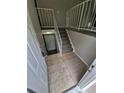 View of an entryway with tile flooring and carpeted stairs at 3246 S Nucla St, Aurora, CO 80013