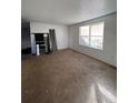 Spacious living room with large window and neutral carpeting at 3246 S Nucla St, Aurora, CO 80013