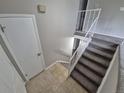 Staircase leading upstairs, featuring carpeted steps and modern railings at 3246 S Nucla St, Aurora, CO 80013
