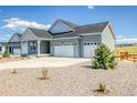 Inviting home with a spacious driveway and landscaping; perfect for suburban living at 39628 Yorktown Ter, Elizabeth, CO 80107