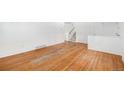 Sunlit living room featuring hardwood floors and bright white walls at 1533 S Jamaica St, Aurora, CO 80012