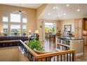 Open-concept living room features high ceilings, and lots of natural light at 13943 W 87Th Ln, Arvada, CO 80005