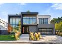 Contemporary home with clean lines, expansive glass, and attractive desert-style landscaping at 42 S Ash St, Denver, CO 80246