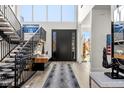 Elegant foyer features a grand staircase, soaring ceilings, and designer finishes at 42 S Ash St, Denver, CO 80246