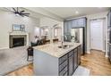 Kitchen island with stainless steel appliances in an open-concept layout at 14310 Kalamath St, Westminster, CO 80023