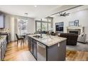 Open-concept kitchen with granite countertops connected to living room at 14310 Kalamath St, Westminster, CO 80023