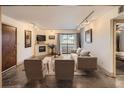Bright living room featuring a fireplace, balcony access, and contemporary furnishings at 400 Zang St # 1-105, Lakewood, CO 80228