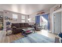 Cozy living room with comfortable seating, access to a patio, and lots of natural light at 8707 E Florida Ave # 410, Denver, CO 80247