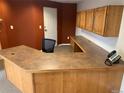 Functional office space featuring built-in cabinets and a spacious L-shaped desk at 3872 S Dallas St # 7-107, Aurora, CO 80014