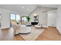 Bright and airy living room with sliding glass doors, hardwood floors and contemporary decor at 1148 Hillside Ln, Louisville, CO 80027