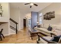 Inviting living room with hardwood floors and comfortable seating, bathed in natural light at 3120 Redhaven Way, Highlands Ranch, CO 80126