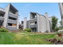 Exterior of a condo with unique architecture surrounded by lush greenery at 9837 E Peakview Ave # D05, Englewood, CO 80111