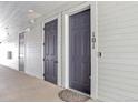 Apartment entryway showcasing unit doors with number 101, white siding, and a welcome mat at 16841 Askins Loop # 101, Parker, CO 80134