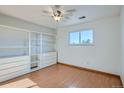 Bedroom with built-in storage and a sunny window for natural light at 16259 W 10Th Ave # J5, Golden, CO 80401