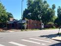 Brick duplex featuring street view, landscaping, and a crosswalk at 292 S Lafayette St, Denver, CO 80209