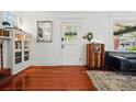 Inviting entryway features hardwood floors, stylish decor, and great natural light at 1141 Adams St, Denver, CO 80206