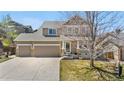 Charming two-story home with a spacious three-car garage and welcoming front porch at 3761 S Orleans St, Aurora, CO 80013