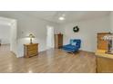 Comfortable bedroom with parquet flooring, a ceiling fan, and simple decor at 13901 E Marina Dr # 113, Aurora, CO 80014