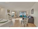 Inviting living room with hardwood floors, and large sliding glass doors leading to a sunroom at 13901 E Marina Dr # 113, Aurora, CO 80014