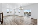 Bright dining room with hardwood floors and access to a deck at 2060 Chambers Rd, Brighton, CO 80601