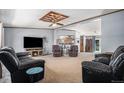 Spacious living room with comfortable seating and a fireplace at 8260 County Road 39, Fort Lupton, CO 80621