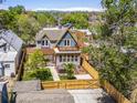 Aerial view of the backyard featuring a pergola, hot tub, and fenced yard at 4348 Umatilla St, Denver, CO 80211