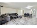 Spacious living room with hardwood floors and a comfortable seating arrangement at 5712 S Lowell Blvd, Littleton, CO 80123