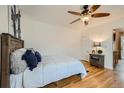 Relaxing bedroom with hardwood floors, ceiling fan, and natural light at 710 E Alameda Ave, Denver, CO 80209