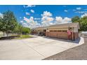 Charming ranch home featuring a well-maintained front yard and an attached two-car garage at 9880 E 157Th Ave, Brighton, CO 80602