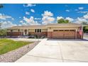 Charming ranch home featuring a well-maintained front yard and an attached two-car garage at 9880 E 157Th Ave, Brighton, CO 80602