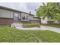 Charming single-story home with brick accents, landscaped front yard, and an attached two-car garage at 10602 W Patterson Pl, Littleton, CO 80127