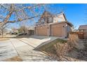Lovely two-story house with a driveway and attached two-car garage at 5128 Longs Peak St, Brighton, CO 80601