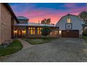 Exterior with stone pathway to front door and separate garage structure at 11881 County Road 37, Fort Lupton, CO 80621