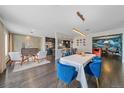 Bright and airy living room featuring hardwood floors, modern decor, and an open-concept layout at 6630 E Virginia Ave, Denver, CO 80224